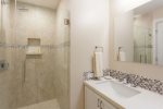The guest bathroom is located on the ground floor and offers guests lots of space